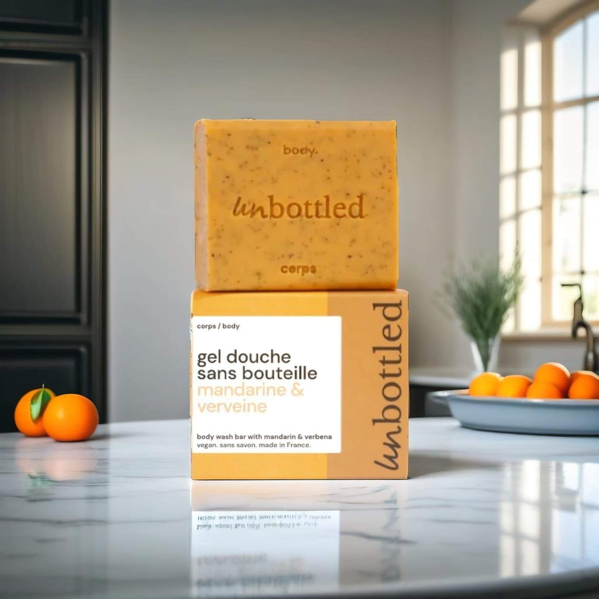 A product standing on a white marble table, surrounded by tangerines, bathroom in the background